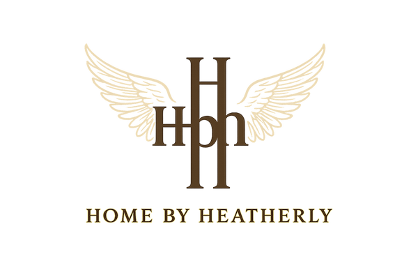 Please write home by Heatherly one line With wings behind and the initials HBH above two H letters, one lowercase B letters letter in the middle representing a +